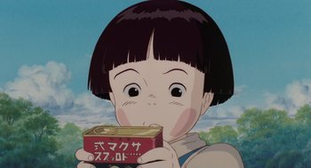 Movie still from “Grave of the Fireflies” (1988), directed by Isao Takahata – A child holding a can of food in front of a sky background; Close Up shot, Low angle