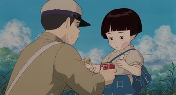 Movie still from “Grave of the Fireflies” (1988), directed by Isao Takahata – An animated scene of a man and a girl; Medium shot, Low angle