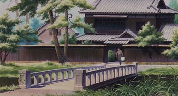 Movie still from “Grave of the Fireflies” (1988), directed by Isao Takahata – A person walking on a bridge near a building; Extreme Wide shot, Low angle