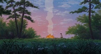 Movie still from “Grave of the Fireflies” (1988), directed by Isao Takahata – A person standing in front of a fire in a field; Extreme Wide shot, Low angle