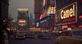 Movie still from “Great Balls of Fire!” (1989), directed by Jim McBride – A city street filled with lots of traffic at night; Extreme Wide shot, High angle