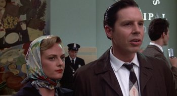 Movie still from “Great Balls of Fire!” (1989), directed by Jim McBride – A man and a woman standing next to each other; Close Up shot, Low angle