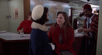 Movie still from “Great Balls of Fire!” (1989), directed by Jim McBride – Two women talking to each other in a restaurant; Medium shot, Over the shoulder angle