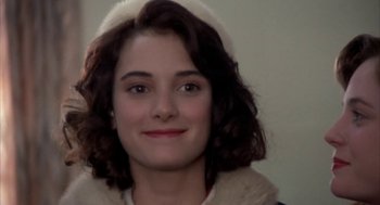 Movie still from “Great Balls of Fire!” (1989), directed by Jim McBride – A person wearing a hat; Close Up shot, Over the shoulder angle