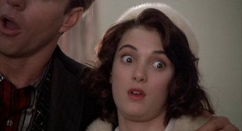 Movie still from “Great Balls of Fire!” (1989), directed by Jim McBride – A man and a woman looking at each other with surprised eyes; Close Up shot, Low angle
