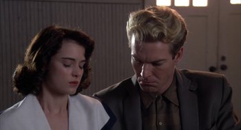 Movie still from “Great Balls of Fire!” (1989), directed by Jim McBride – A man and a woman looking at each other; Close Up shot, Low angle