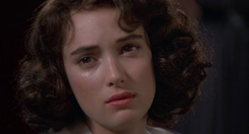 Movie still from “Great Balls of Fire!” (1989), directed by Jim McBride – A person with curly brown hair; Close Up shot, Over the shoulder angle