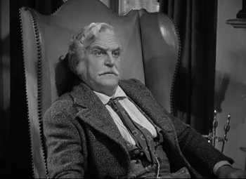 Movie still from “Green Dolphin Street” (1947), directed by Victor Saville – An old man sitting in a chair wearing a suit and tie; Medium shot, High angle
