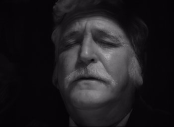 Movie still from “Green Dolphin Street” (1947), directed by Victor Saville – An old man with a mustache and a beard; Close Up shot, High angle