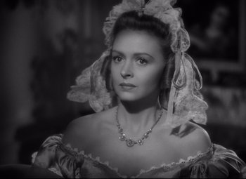 Movie still from “Green Dolphin Street” (1947), directed by Victor Saville – A black and white photo of a woman in a dress; Close Up shot, Over the shoulder angle