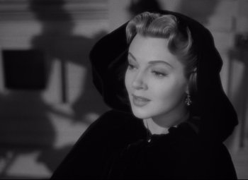 Movie still from “Green Dolphin Street” (1947), directed by Victor Saville – An old black and white photo of a woman wearing a hood; Close Up shot, Over the shoulder angle