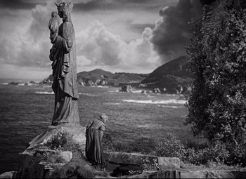 Movie still from “Green Dolphin Street” (1947), directed by Victor Saville – A statue of a woman holding a child in her arms; Extreme Wide shot, Low angle