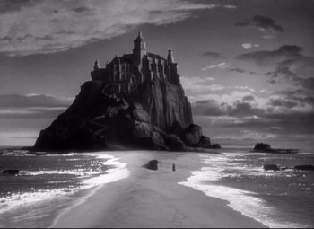 Movie still from “Green Dolphin Street” (1947), directed by Victor Saville – A black - and - white photo of a castle on a hill; Extreme Wide shot, Low angle
