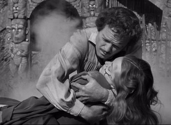 Movie still from “Green Dolphin Street” (1947), directed by Victor Saville – A man and a woman are fighting in a black and white photo; Medium shot, High angle