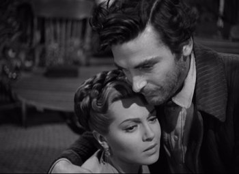 Movie still from “Green Dolphin Street” (1947), directed by Victor Saville – A man and a woman embracing each other in a black and white photo; Close Up shot, High angle