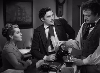 Movie still from “Green Dolphin Street” (1947), directed by Victor Saville – A group of people sitting around a table; Medium shot, Over the shoulder angle