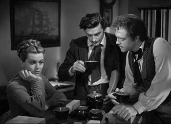 Movie still from “Green Dolphin Street” (1947), directed by Victor Saville – A group of people sitting at a table with food; Medium shot, High angle