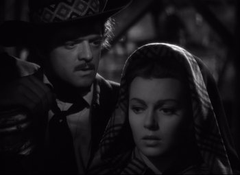 Movie still from “Green Dolphin Street” (1947), directed by Victor Saville – A man and a woman are standing next to each other; Close Up shot, Low angle