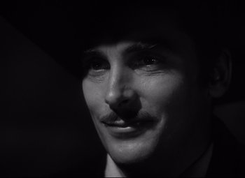 Movie still from “Green Dolphin Street” (1947), directed by Victor Saville – A black and white photo of a man with a mustache; Close Up shot, Low angle