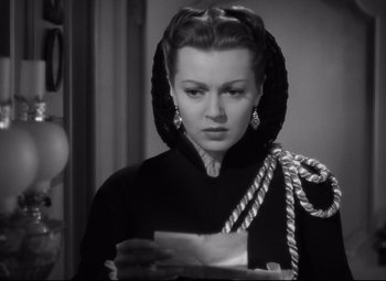 Movie still from “Green Dolphin Street” (1947), directed by Victor Saville – A black and white photo of a woman in a hooded jacket; Close Up shot, Over the shoulder angle