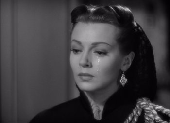 Movie still from “Green Dolphin Street” (1947), directed by Victor Saville – An old photo of a woman with a tear on her face; Close Up shot, Low angle