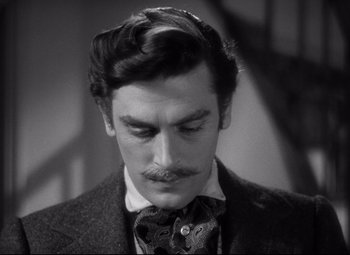 Movie still from “Green Dolphin Street” (1947), directed by Victor Saville – A black and white photo of a man with a mustache; Close Up shot, Over the shoulder angle