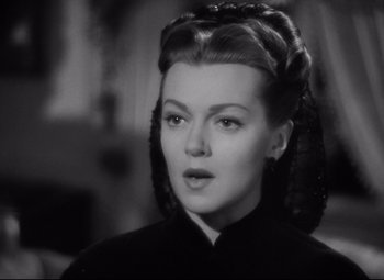 Movie still from “Green Dolphin Street” (1947), directed by Victor Saville – A black and white photo of a woman in a black dress; Close Up shot, Over the shoulder angle