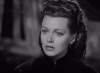 Movie still from “Green Dolphin Street” (1947), directed by Victor Saville – A black and white photo of a woman in a black dress; Close Up shot, Over the shoulder angle