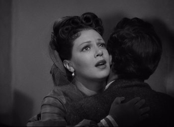 Movie still from “Green Dolphin Street” (1947), directed by Victor Saville – An old photo of a woman hugging a young boy; Close Up shot, Over the shoulder angle