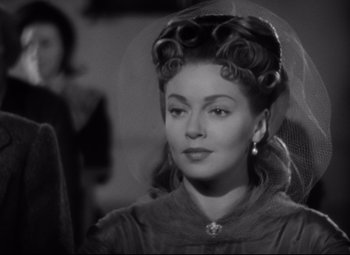 Movie still from “Green Dolphin Street” (1947), directed by Victor Saville – A black and white photo of a woman with a veil; Close Up shot, Over the shoulder angle