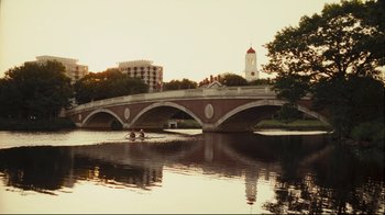 Movie still from “Green Street Hooligans” (2005), directed by Lexi Alexander – Two people rowing a boat across a bridge; Extreme Wide shot, High angle