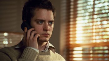 Movie still from “Green Street Hooligans” (2005), directed by Lexi Alexander – A young man is talking on a cell phone; Close Up shot, Low angle