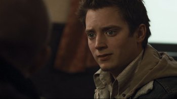 Movie still from “Green Street Hooligans” (2005), directed by Lexi Alexander – A person wearing a button up shirt; Close Up shot, Over the shoulder angle