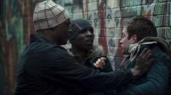 Movie still from “Green Street Hooligans” (2005), directed by Lexi Alexander – A group of men standing next to each other; Medium shot, Over the shoulder angle
