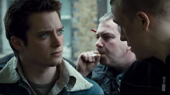 Movie still from “Green Street Hooligans” (2005), directed by Lexi Alexander – A group of men standing next to each other on a street; Close Up shot, Over the shoulder angle