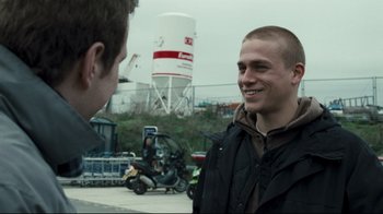 Movie still from “Green Street Hooligans” (2005), directed by Lexi Alexander – Two men talking to each other in a parking lot; Close Up shot, Over the shoulder angle