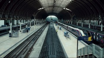 Movie still from “Green Street Hooligans” (2005), directed by Lexi Alexander – A train station with people waiting for the train; Extreme Wide shot, High angle