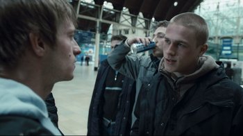 Movie still from “Green Street Hooligans” (2005), directed by Lexi Alexander – A group of young men standing next to each other; Medium shot, Over the shoulder angle