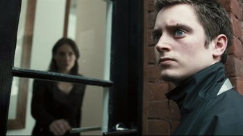 Movie still from “Green Street Hooligans” (2005), directed by Lexi Alexander – A man and a woman looking at each other in a mirror; Close Up shot, Over the shoulder angle