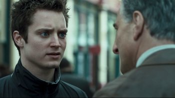 Movie still from “Green Street Hooligans” (2005), directed by Lexi Alexander – Two men are talking to each other on the street; Close Up shot, Over the shoulder angle