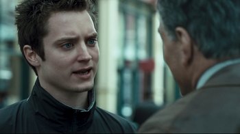Movie still from “Green Street Hooligans” (2005), directed by Lexi Alexander – A young man talking to another man on the street; Close Up shot, Over the shoulder angle