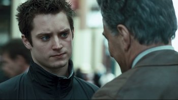 Movie still from “Green Street Hooligans” (2005), directed by Lexi Alexander – A young man and an older man are talking together; Close Up shot, Over the shoulder angle