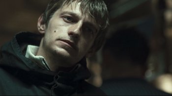 Movie still from “Green Street Hooligans” (2005), directed by Lexi Alexander – A person wearing a jacket; Close Up shot, Low angle
