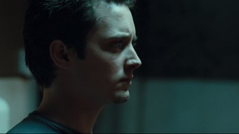 Movie still from “Green Street Hooligans” (2005), directed by Lexi Alexander – A person looking to his left; Close Up shot, Low angle