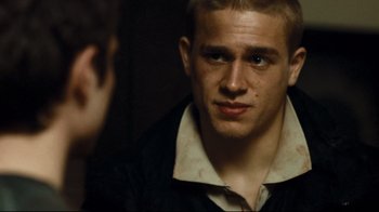 Movie still from “Green Street Hooligans” (2005), directed by Lexi Alexander – A young man looking into a mirror while standing next to another young man; Close Up shot, Over the shoulder angle
