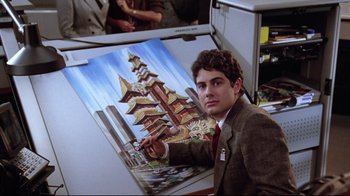 Movie still from “Gremlins 2: The New Batch” (1990), directed by Joe Dante – A man in a suit and tie standing in front of a painting; Close Up shot, Low angle