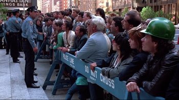 Movie still from “Gremlins 2: The New Batch” (1990), directed by Joe Dante – A group of people standing next to each other on the street; Wide shot, High angle
