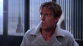 Movie still from “Gremlins 2: The New Batch” (1990), directed by Joe Dante – A person wearing a jacket; Close Up shot, Low angle