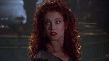 Movie still from “Gremlins 2: The New Batch” (1990), directed by Joe Dante – A person with curly hair; Close Up shot, Low angle