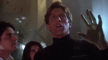 Movie still from “Gremlins 2: The New Batch” (1990), directed by Joe Dante – A man and a woman are looking up at something; Close Up shot, Low angle